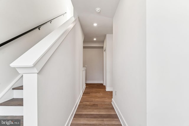 stairway featuring hardwood / wood-style flooring