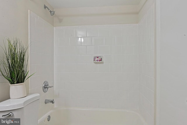 bathroom featuring toilet and shower / bathing tub combination