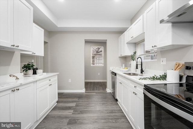 kitchen featuring range with electric cooktop, extractor fan, dishwasher, white cabinetry, and sink