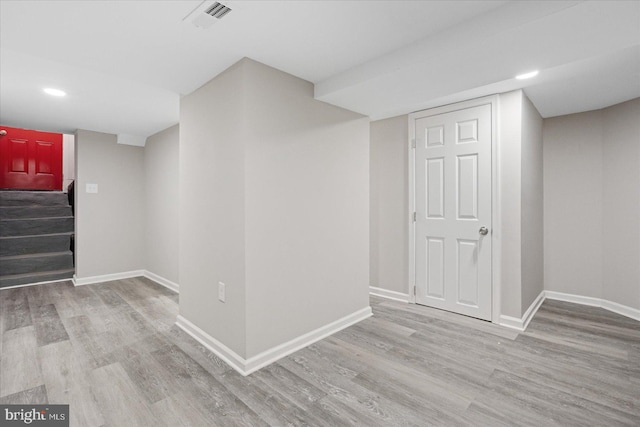 basement featuring light hardwood / wood-style flooring