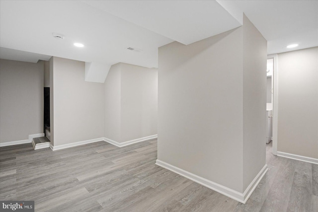 basement with light wood-type flooring