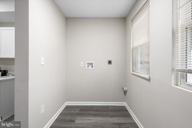 clothes washing area featuring dark hardwood / wood-style flooring, hookup for a washing machine, and electric dryer hookup