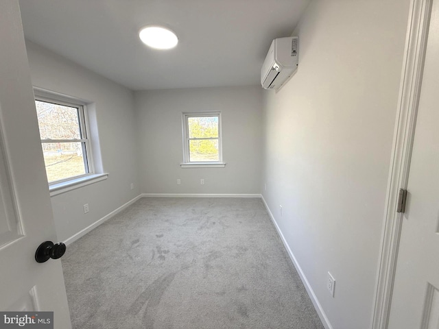 carpeted empty room featuring a wall unit AC