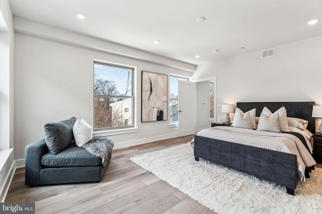 bedroom with light hardwood / wood-style flooring