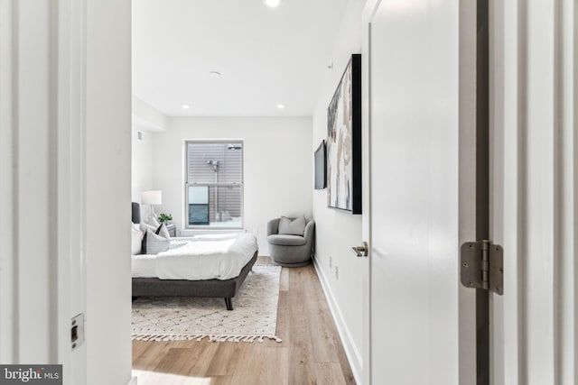 bedroom with light hardwood / wood-style floors