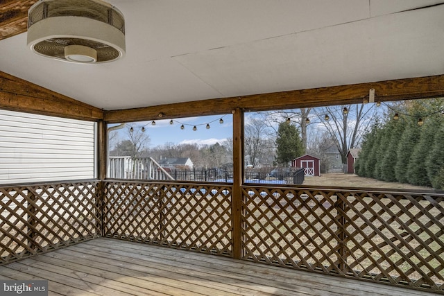 deck with a storage shed