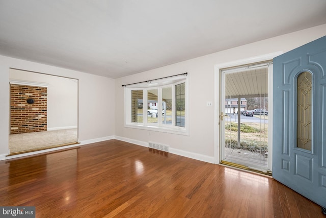 interior space featuring hardwood / wood-style floors and a wealth of natural light