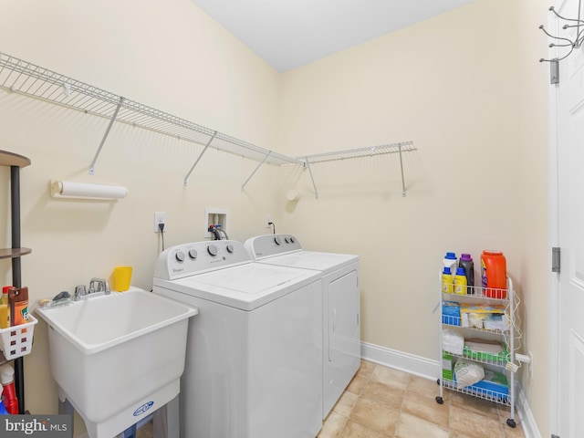 laundry room featuring sink and washing machine and dryer