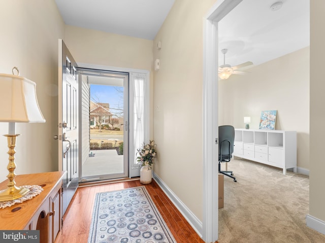 entryway featuring ceiling fan and light hardwood / wood-style floors