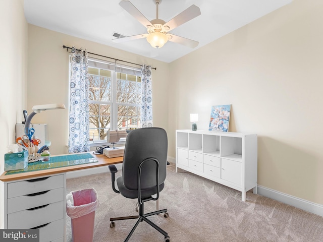 office featuring light carpet and ceiling fan