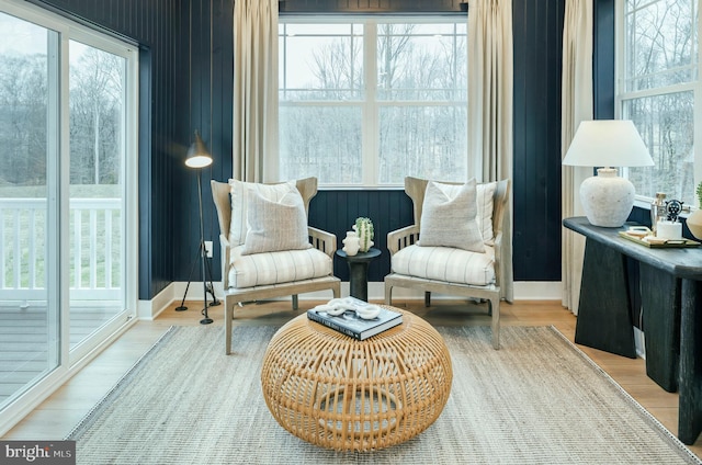 sitting room featuring a wealth of natural light and wood-type flooring