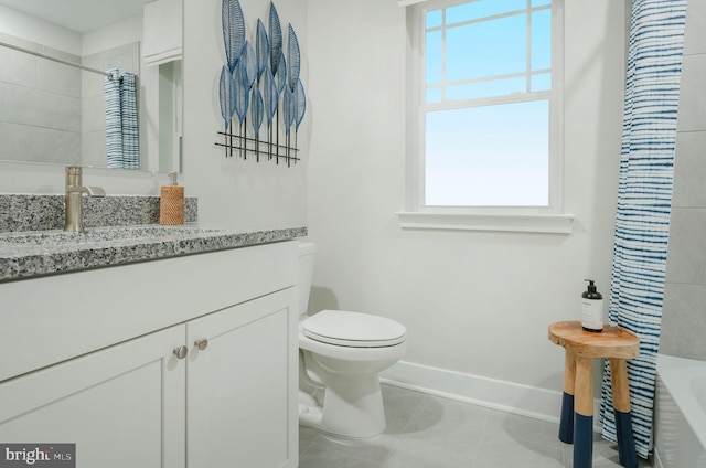 full bathroom featuring vanity, tile patterned flooring, a wealth of natural light, and toilet