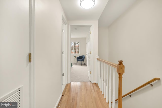 hallway with light wood-type flooring