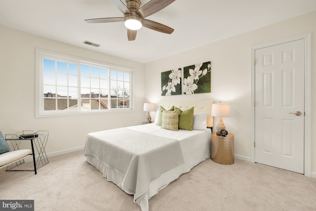 carpeted bedroom featuring ceiling fan