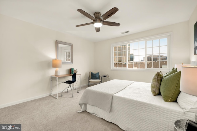 carpeted bedroom with ceiling fan