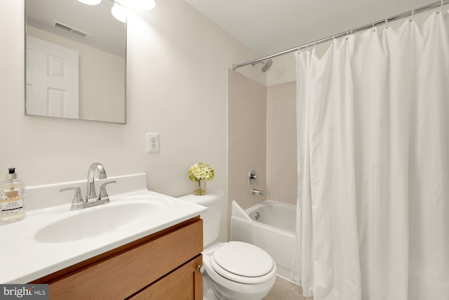 full bathroom with vanity, shower / bath combo with shower curtain, and toilet