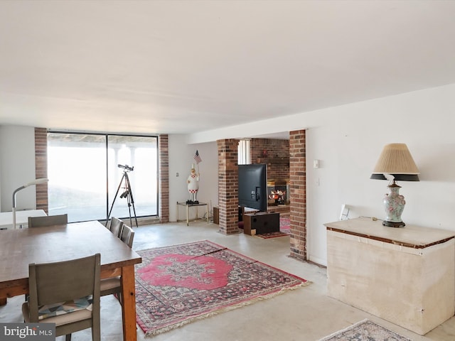 dining area featuring concrete flooring