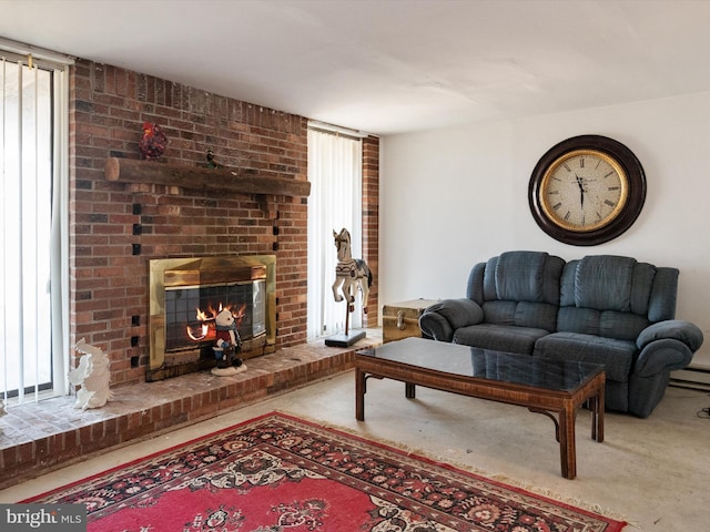 living area with carpet and a fireplace