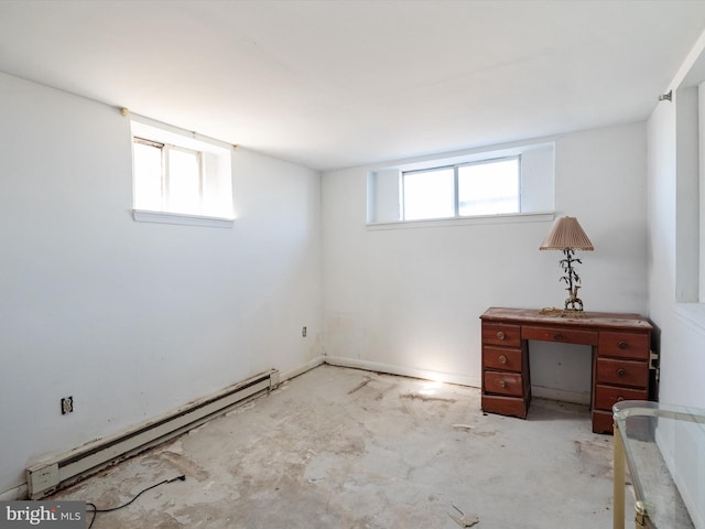 below grade area featuring a wealth of natural light and a baseboard radiator