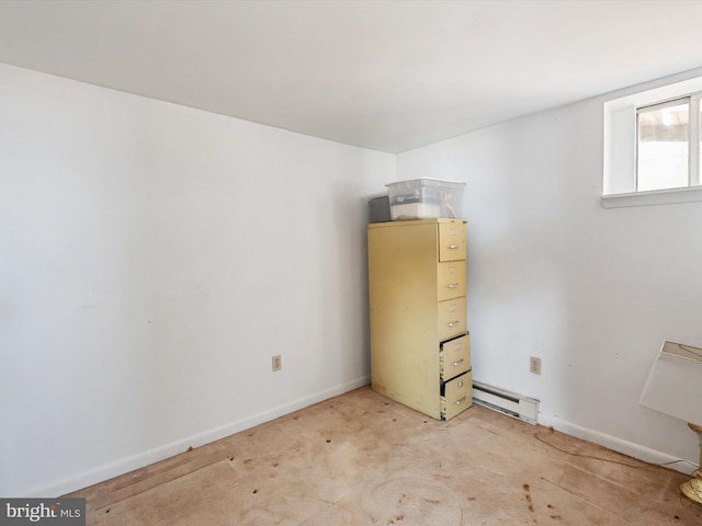 unfurnished room with baseboards, a baseboard heating unit, and light colored carpet