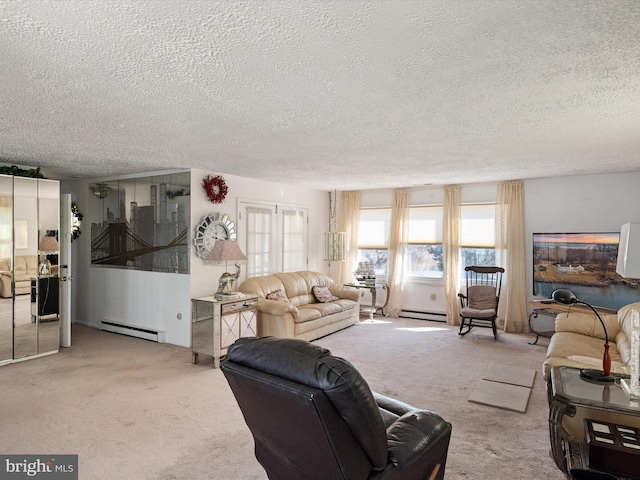 carpeted living area with a baseboard heating unit and a textured ceiling