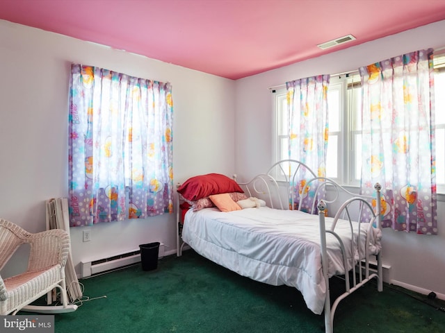 carpeted bedroom with baseboard heating, visible vents, and baseboards