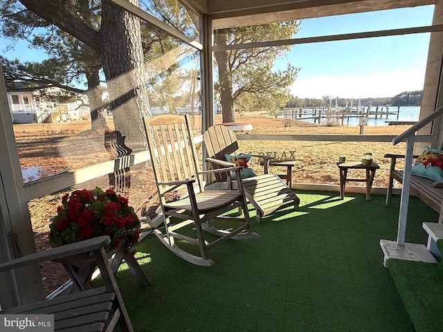 view of patio with a water view