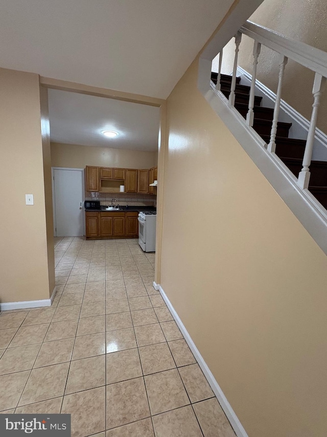 interior space with sink and light tile patterned floors