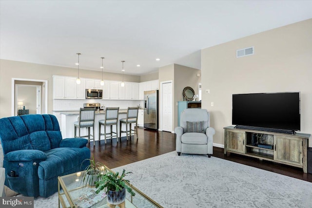 living room featuring dark wood-type flooring