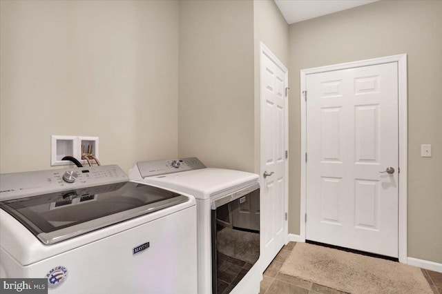 laundry room with washing machine and clothes dryer