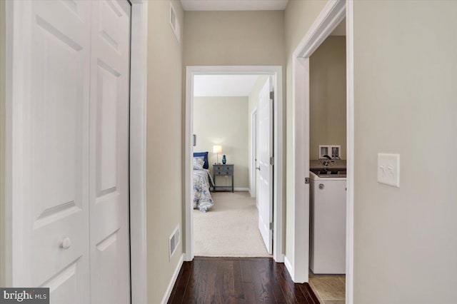 hall with dark hardwood / wood-style floors