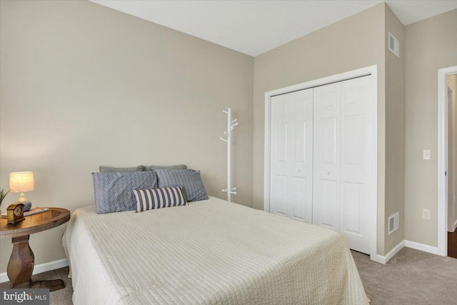 carpeted bedroom with a closet