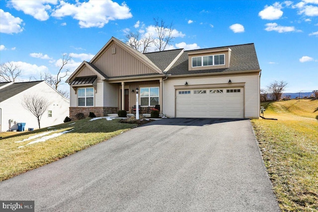 view of front facade featuring a garage and a front yard