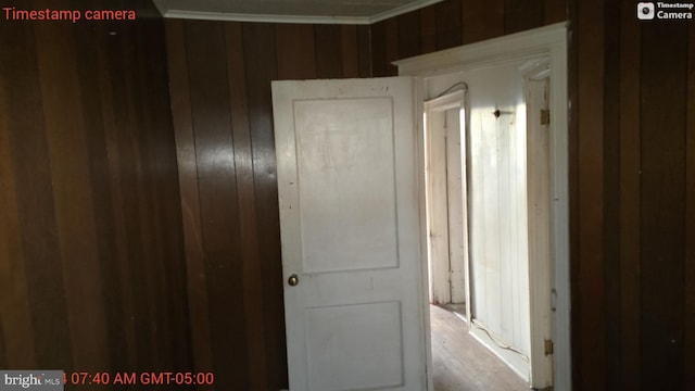 hallway featuring crown molding