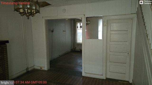 hallway with dark hardwood / wood-style floors