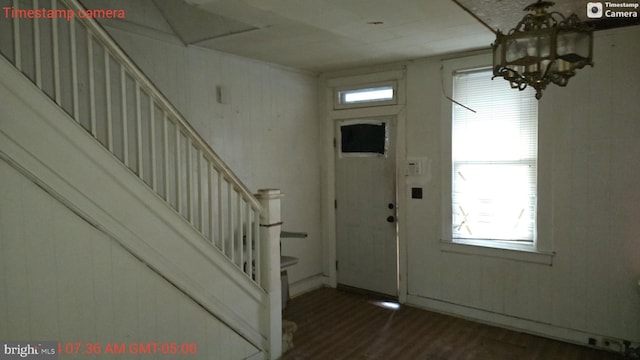 foyer entrance with dark hardwood / wood-style floors