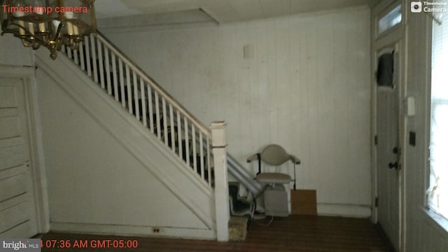 staircase featuring hardwood / wood-style flooring