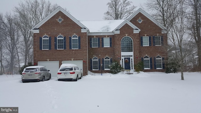 colonial-style house with brick siding and an attached garage