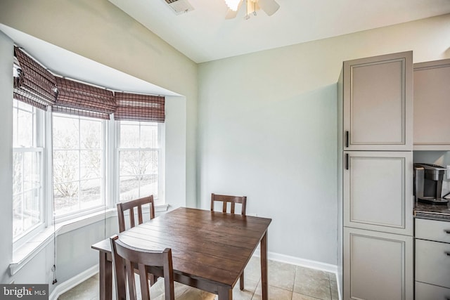 dining room with light tile patterned floors and ceiling fan