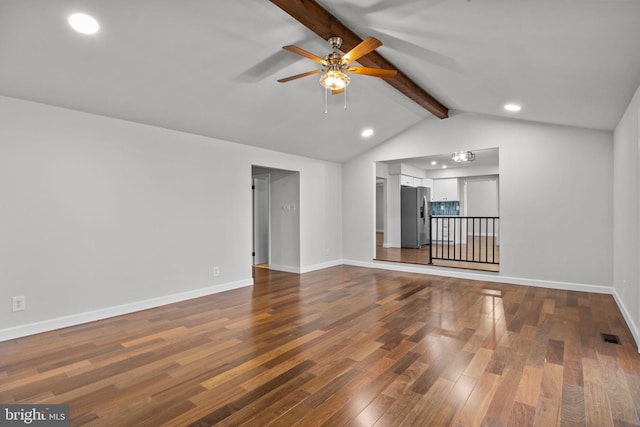 unfurnished living room with hardwood / wood-style flooring, ceiling fan, and vaulted ceiling with beams