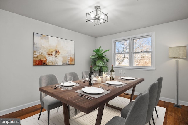 dining space with an inviting chandelier and wood-type flooring