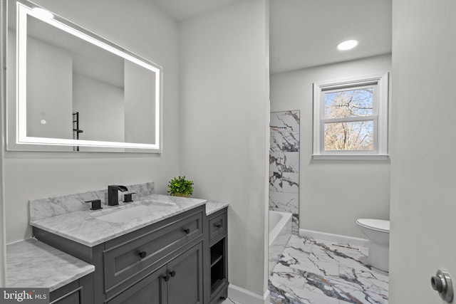 full bathroom with vanity, tiled shower / bath combo, and toilet