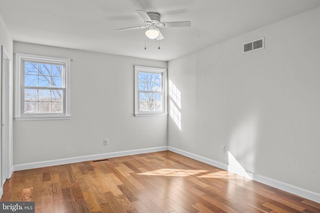 spare room featuring ceiling fan and light wood-type flooring