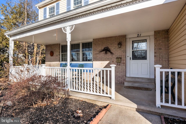 doorway to property with covered porch