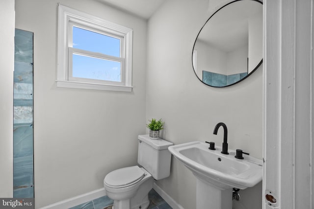 bathroom featuring sink and toilet