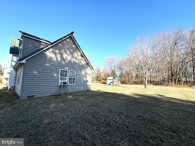 view of side of property with cooling unit and a lawn