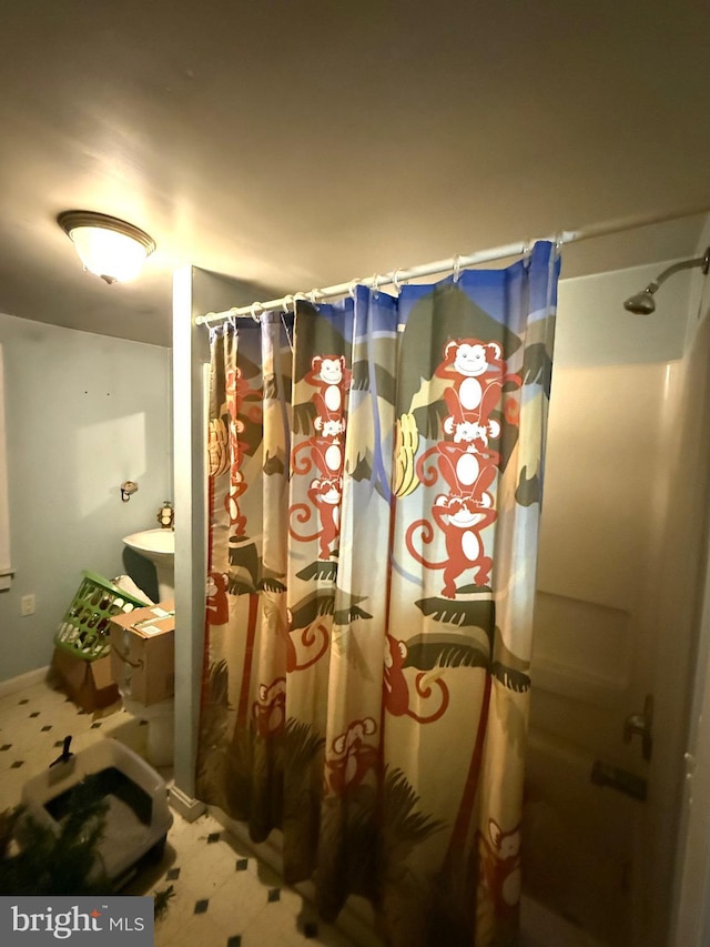 bathroom with a shower with curtain