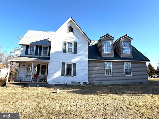 view of front of house featuring a front yard and covered porch