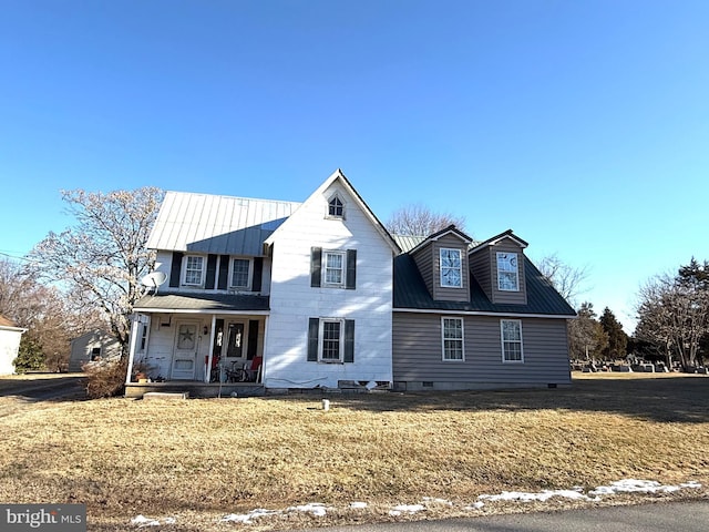 front facade featuring a front lawn and a porch