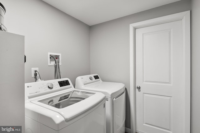 laundry room featuring separate washer and dryer